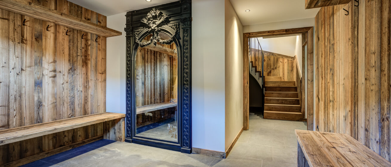 Chalet Bergeronnette, Meribel - chalet entrance with benches and boot room